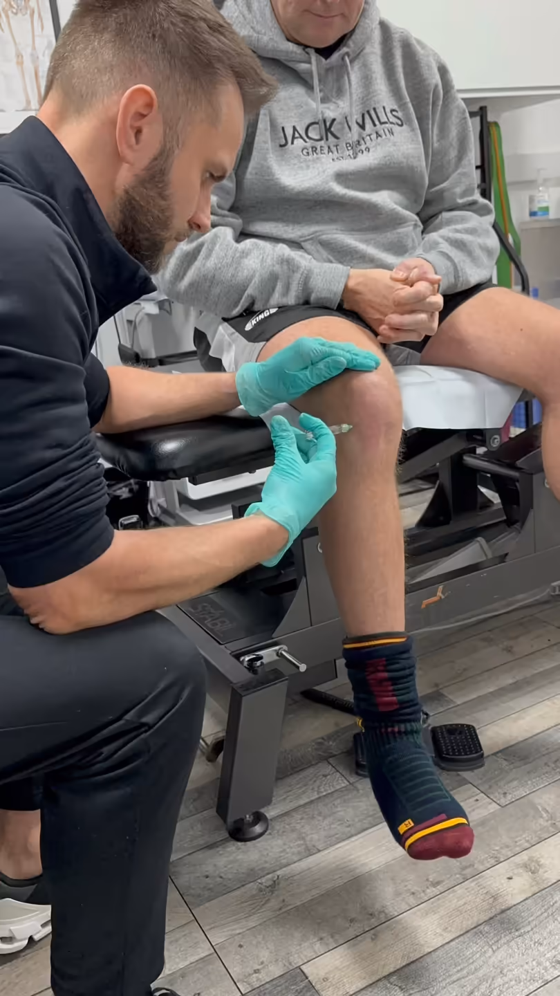 Physiotherapist guiding a patient through joint mobility exercises for osteoarthritis