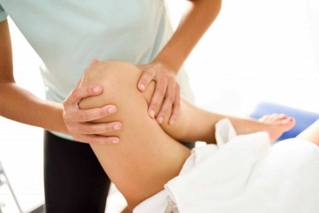 medical massage at the leg in a physiotherapy cent L2P87TY scaled 1